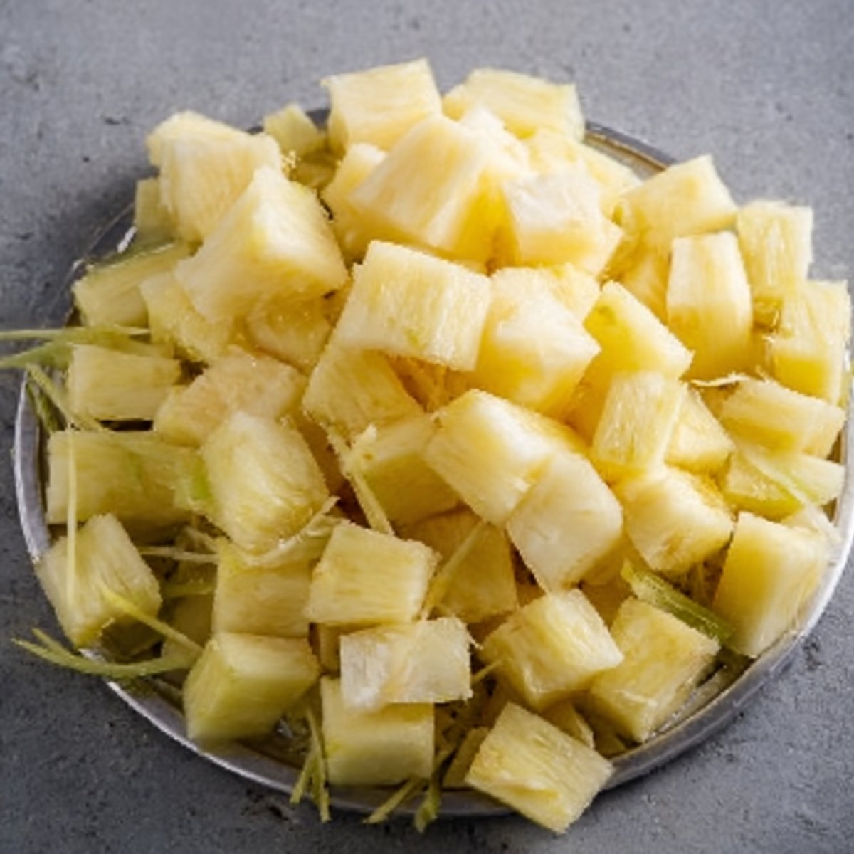 Chopped Sugarcane pieces, freshly cut and ready to be used in recipes or beverages.